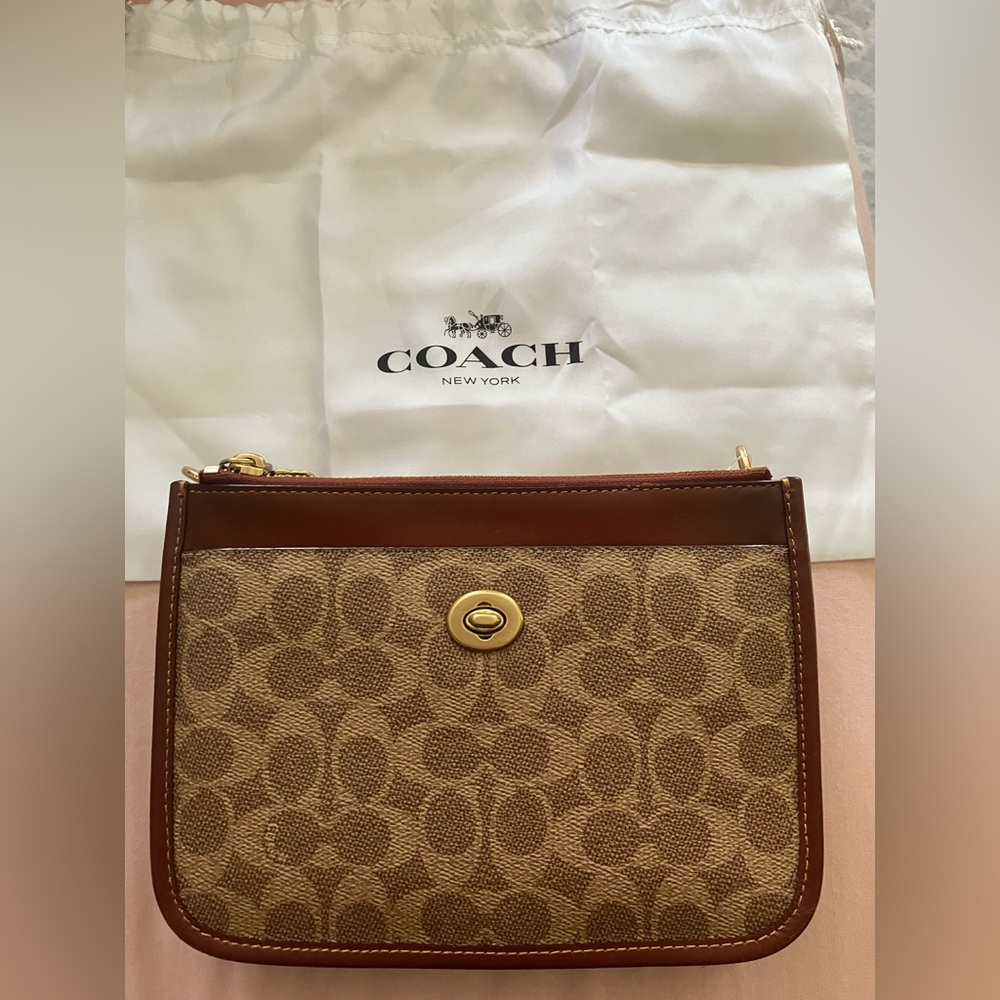 Coach purse, brown leather, magnetic snap closure. Comes with shoulder strap